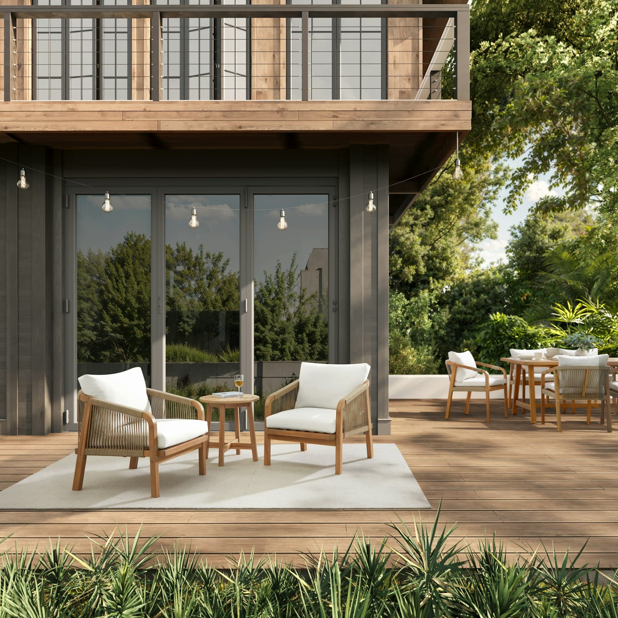 Modern wood deck and lounge area off a glass-walled home, surrounded by trees